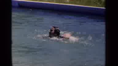 New York (1951): Girl Swims In The Pool As Toddler Plays With Toy Watering Can