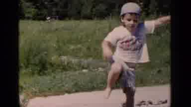 New York (1951): Boy Wearing A Backwards Baseball Cap And Shorts Walking Down