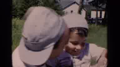 New York (1951): Dad Kissing Toddler Son While Enjoying The Weather On A Beautiful