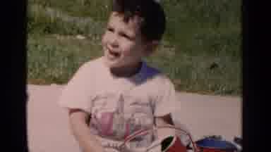 New York (1951): Little Boys Sits On A Blanket Outside Playing With A Toy