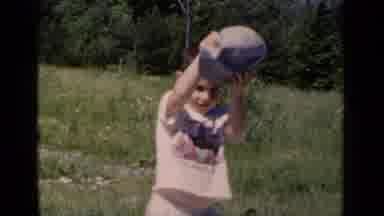 New York (1951): Child Playing Outside And Putting On Hat