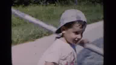 New York (1951): Child Licking His Nose At The Edge Of A Plastic Pool