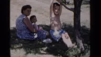 New York (1951): Kid Swinging On Branch As His Mom And Sister Watch Behind Him