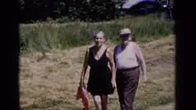 New York (1951): Elderly Man And Woman Stroll Leisurely Down Path Car Drives By In