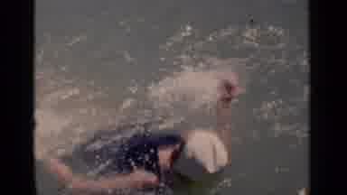 New York (1951): Footage Of A Woman Swimming On Her Back And A Man Diving Into The