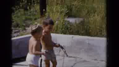 New York (1951): Two Young Boys Standing On A Patio Without Shirts On Holding S