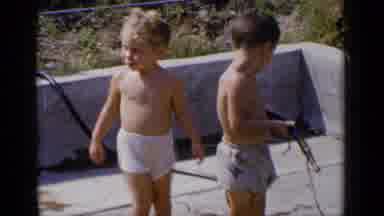 New York (1951): Two Children In Swim Trunks Playing Near A Small Inflatable Pool