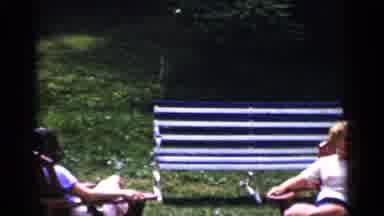 New York (1951): Women In Lawn Chairs Relaxing In The Yard By A House