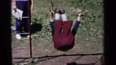 New York-1951: Child Performing Front Flip On Playground Rings