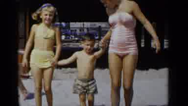 New York (1951): Woman In A Pink Bathing Suit With Small Children At The Beach