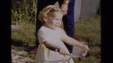 New York (1951): Happy Little Girl In A Cute Yellow Dress On Her First Trike Ride