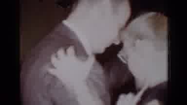 New York (1954): Little Boy Is Startled By Dog Then Follows Man Out Towards Shed