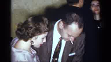 New York (1954): A Man In A Suit Smoking Dancing With A Woman In Purple