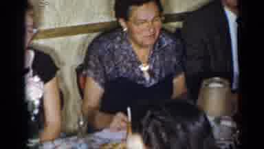 New York (1954): Large Group Of People Sitting At A Table While Eating And Talking