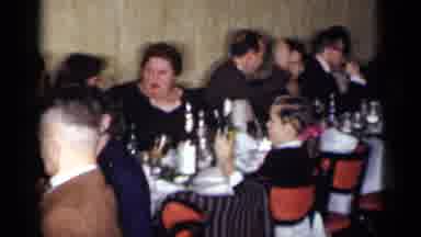 New York (1954): People Dress In Black Formalwear Sitting At Long Banquet Table