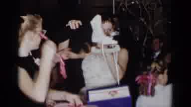 New York (1954): Women In Dress Opening A Present That Has Ski Shoes In It