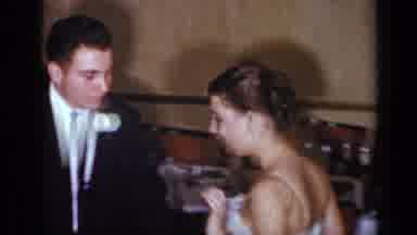 New York (1954): Woman Wearing Black Dress Dances With Man Wearing Black Suit Near