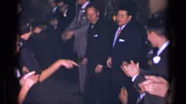 New York (1954): Woman Wearing White Dress Dances With Man Wearing Black Suit