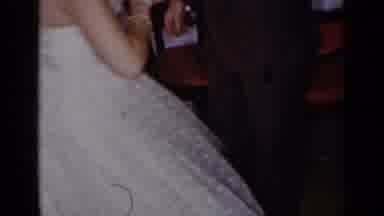 New York (1954): A Woman In A White Dress Dancing With A Man In A Brown Suite