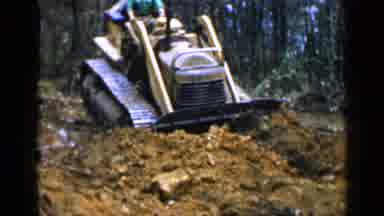 Birmingham Alabama (1957): Dirt Being Moved By A Bulldozer