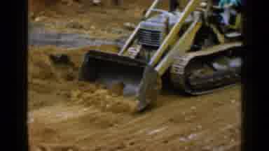 Birmingham Alabama (1957): A Orange Coloured Bulldozer Trying To Remove Sand For