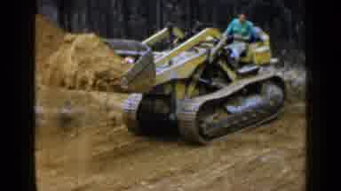 Birmingham Alabama (1957): Working Man Moving Dirt With A Large Machine In A