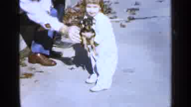 Birmingham Alabama (1957): Man Hands Small Dog To Little Girl Who Then Drops It On