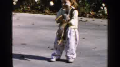 Birmingham Alabama (1957): Toddler Chases Dog Then Holds Him Then Puts Him Down