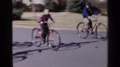 Birmingham Alabama (1957): Boys Riding Bicycles By A Building Permit Sign
