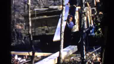Birmingham Alabama (1957): Man With Blue Shirt Unloading Lumber From A Truck