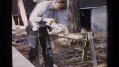 Birmingham Alabama (1957): Elderly Man Cuts Wood With An Electric Saw