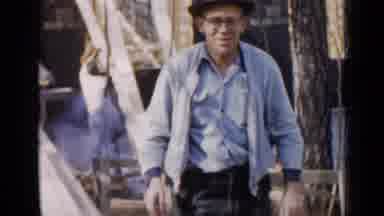 Birmingham Alabama (1957): A Man Uses A Miter Saw To Saw Wood For Building While A