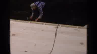 Birmingham Alabama (1957): Man Sitting On Roof While Other Man Is Building The