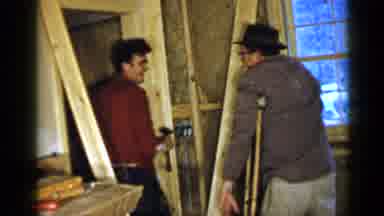 Birmingham Alabama (1957): Man In Red Shirt Works On Doorway Then Man In Hat Grabs