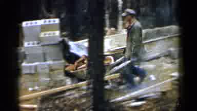 Birmingham Alabama (1957): Industrial Worker Wheels A Load Of Heavy Bricks Through