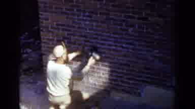 Birmingham Alabama (1957): Workers Grind And Clean Brick Wall