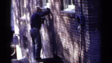 Birmingham Alabama (1957): Leaning Tower Architecture With Woman Standing By