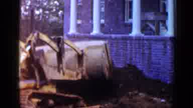 Birmingham Alabama (1957): Man Using Bulldozer To Dig Dirt Outside In Front Yard