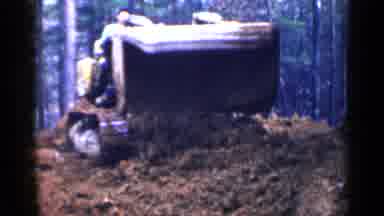 Birmingham Alabama (1957): Tractor With Carrying Dirt Dumping It On A Bigger Pile