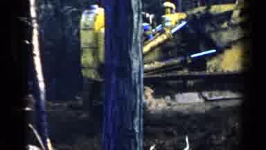 Birmingham Alabama (1957): Man Wearing Blue Shirt Operates Yellow Bulldozer On A