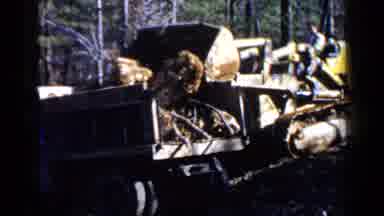 Birmingham Alabama (1957): A Bulldozer Transporting Big Rocks In Back Of A Truck