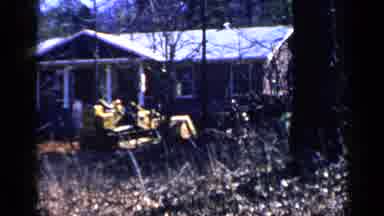 Birmingham Alabama (1957): Man Operating A Yellow High Lift Using The Bucket To