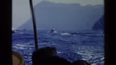 Rome Italy (1960): In A Cove Surrounded By Mountains A Man Stands In A Boat In The