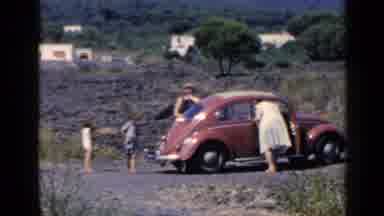 Rome Italy (1960): Woman Strikes A Pose And Then Hugs And Kisses Man
