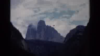 Venice Italy (1960): Mountain Top And Then Canal In City With People On Boat Going