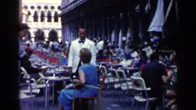 Venice Italy (1960): Man In A White Tuxedo Jacket Talks With A Woman In A Blue