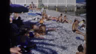Venice Italy (1960): People Laying On The Sand And Walking In The Water At The