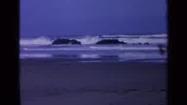 California USA (1963): Large Waves Washing Over Big Boulders In The Water Before
