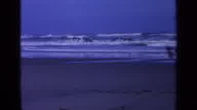 California USA (1963): Ocean Waves Washing Over Two Rocks And Breaking Near The