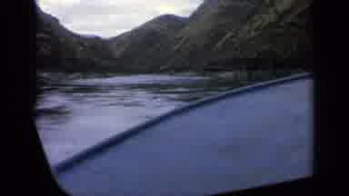 Idaho USA (1963): Low Angle View Of A Boat Riding The Water Of A Large Calm River
